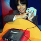 Nintendo game designer Shigeru Miyamoto shows off the Nintendo 64 and its controller in the 1990s.